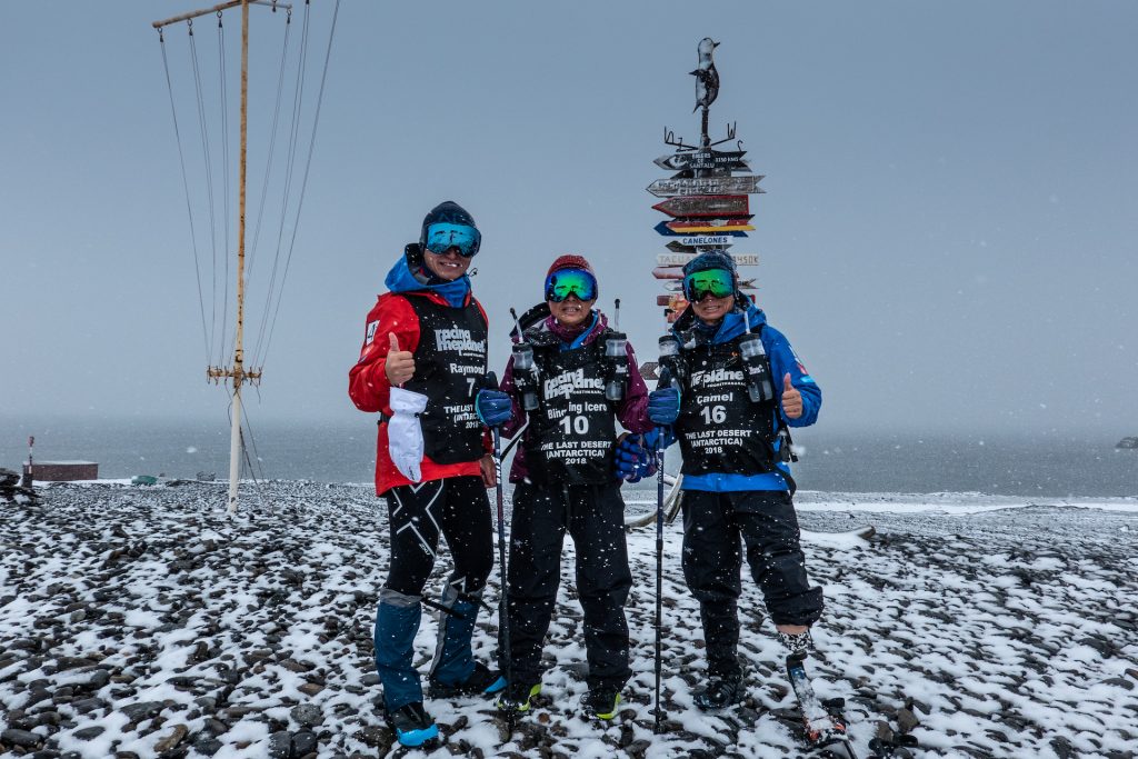 The "Five Legs Never Quit" Team posing during their race in the Antartica.